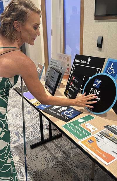 Joanne with Braille Tactile Signs Products