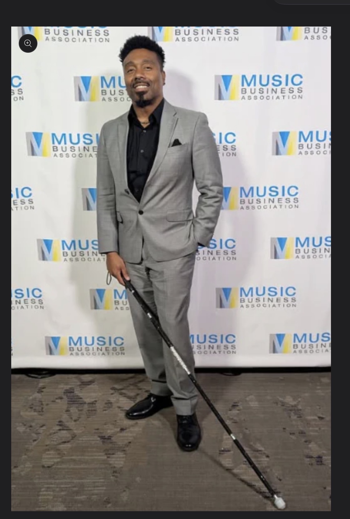 man In a tux with a black cane