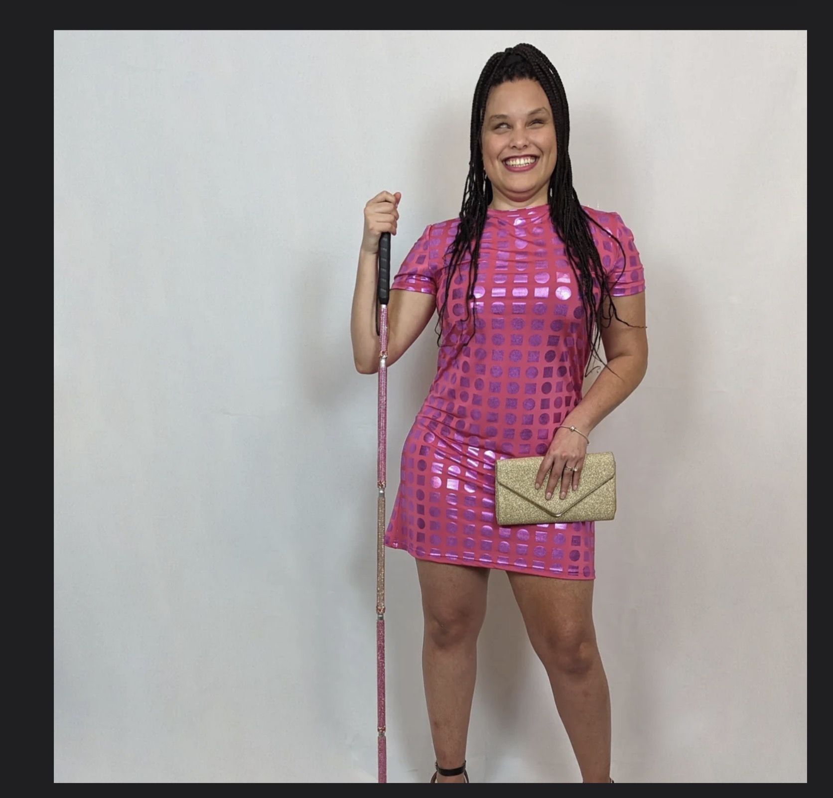 woman in a pink dress with a custom pink cane